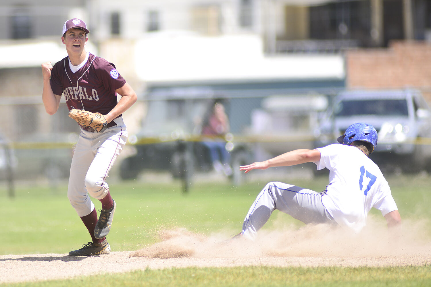Mason Moon celebrates the final out of the first game with a clenched fist
